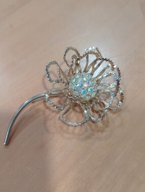 Sarah Coventry Allusion Gold-Tone Floral Brooch with Aurora Borealis Center